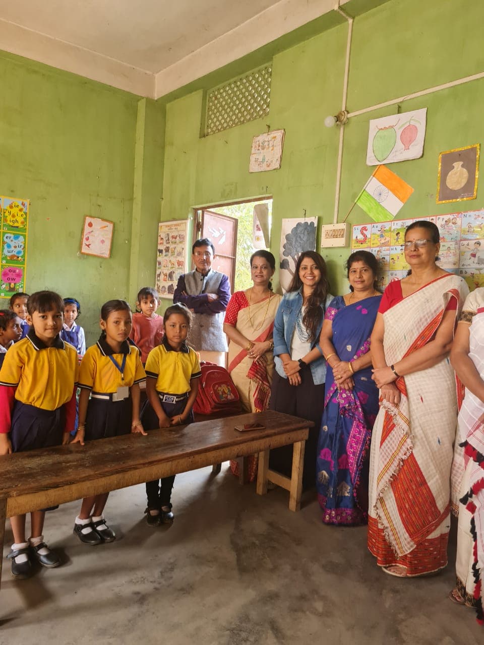 Schoolgirls and educators in an Assam classroom